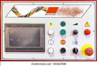 Control panel of a red recycling machine. Recycles plastic and glass bottles. Control panel with computer monitor and different buttons.