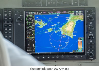 Control panel in small private aircraft flying over Boracay island,  dashboard with displays, dials, buttons, switches, faders, knobs, other toggle items, modern aviation and aerospace industry 