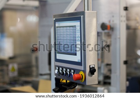 Control panel of testing equipment on a factory production line. Selective focus.