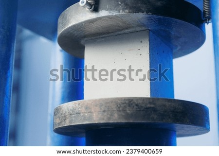 Similar – Image, Stock Photo Test of cement compressive strength according to standards, properties of engineered composite materials and cement strength are tested in the physics laboratory.