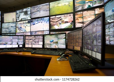 The control room of the city surveillance center. Computer monitors showing the cameras all over the city.