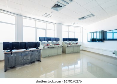 Control room with machines and computers.
