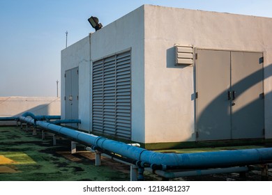 
Control Room On Deck Top Of Industrial Building With Soft Warm Light In Morning