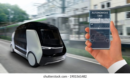 Control Of Self Driving Taxi By Mobile App. Hand With Phone On A Background Of Autonomous Shuttle.