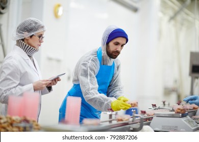 Control Staff In Uniform Checking Weight And Quality Of Seafood During Processing