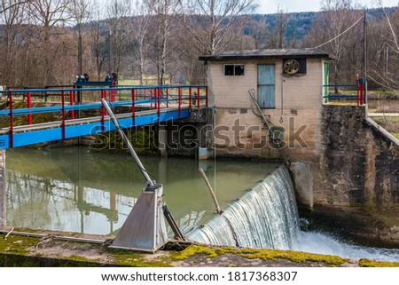 Controlled weir by the river to dam the water