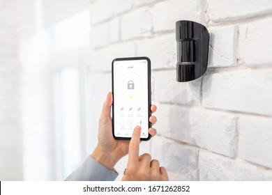 Controlling alarm system with smart phone and special mobile application wireless, holding device the motion sensor indoors