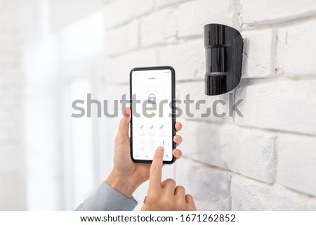 Controlling alarm system with smart phone and special mobile application wireless, holding device the motion sensor indoors