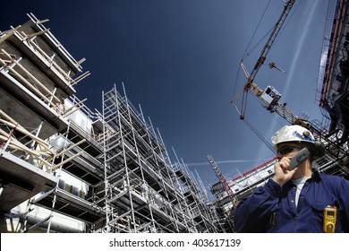 Contruction Worker, Building Site And Cranes