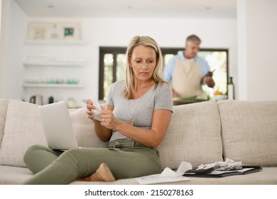 The Convenient Way To Pay Your Bills. Shot Of A Mature Woman Paying Her Bills Online.