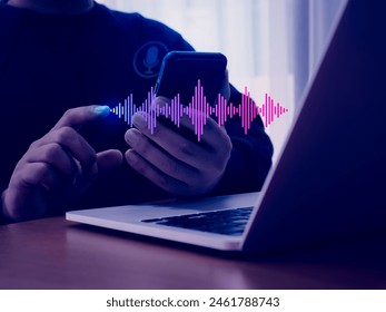 Conversation and voice searching automation, voice recognition technology concept. AI personal conversational assistant technology with digital sound wave audio graphic on smartphone in person hand.