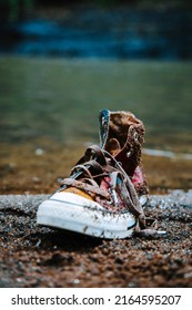 A Converse On A Water Front Dirty