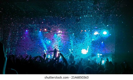 Convert With Confetti. Passionate Performance. People With Hands In The Air 