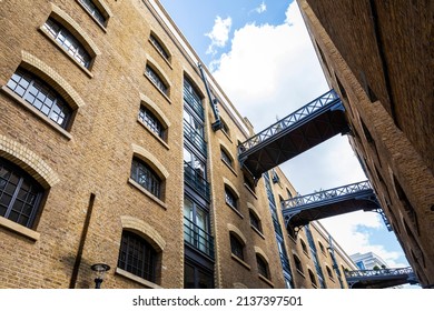 Converted warehouses with walkways and balconies in Shad Thames, Southwark, London UK