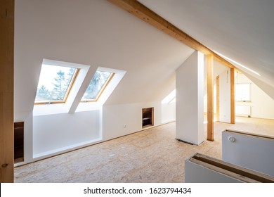 Converting an old attic into a light spacious living room - Shutterstock ID 1623794434