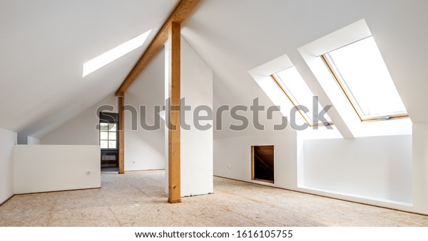 Converting\
an old attic into a light spacious living\
room