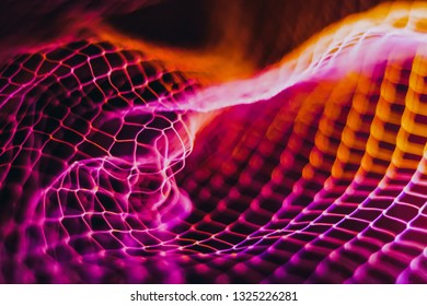 Convex mesh that represents internet connectivity. The bright colors of the linked wire are characteristic of waves. concept cloud computing and neural networks.