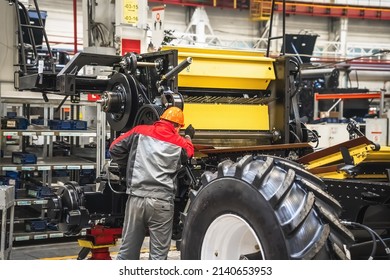 Conveyor for assembly of modern agricultural machinery. Production of tractors and combines at automated plant or factory - Shutterstock ID 2140653953