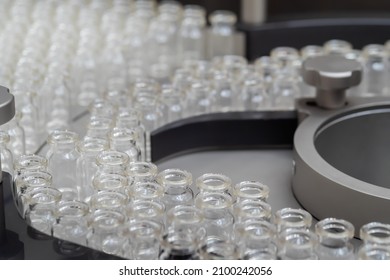 Conveyor Belt With Empty Medical Injection Glass Vials - Pharmaceutical Automatic Production Line. Pharmaceutical Industry, Manufacturing, Medicine And Automated Pharma Technology Equipment Concept