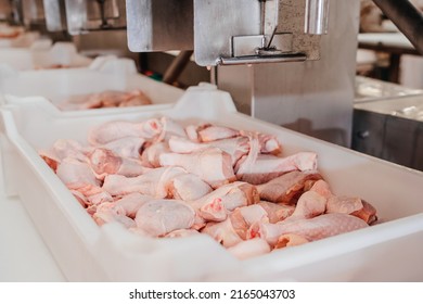 Conveyor Belt Food.The Meat Factory.Automated Production Line In Modern Food Factory.Containers On A Conveyor Line With Raw Chicken Drumstick.Factory For The Production Of Food From Meat,poultry.