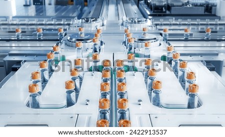 Conveyor Belt with Glass Vials at Advanced Bright Modern Pharmaceutical Factory. Medical Ampoule Production Line. Vaccine Production Facility. Medication Manufacturing Process. 