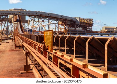 Conveyor belt for mineral export at port - Shutterstock ID 2013340475