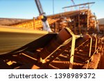 Conveyor belt and rollers structures line machinery its transfer iron ore into material screen house construction mine site, Sydney, Australia