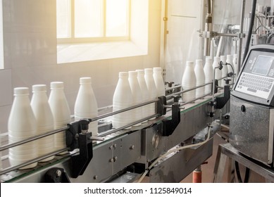 Conveyor Belt With White Milk Bottles