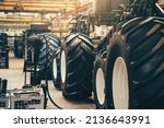 Conveyor line for production and assembly of large industrial machines, tractors or combines with big rubber tires in factory