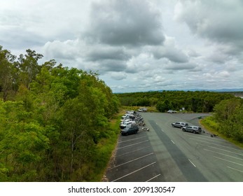 Conway Beach, Queensland, Australia - December 2021: Low Perspective Of Drone Flight As It Takes Off From A Car Park At A Boat Ramp Car Park Under A Cloudy Sky