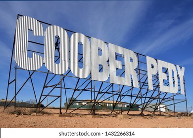 Coober Pedy road sign.Coober Pedy is a town in South Australia that supplying most of the world's gem-quality opal. No people. Copy space