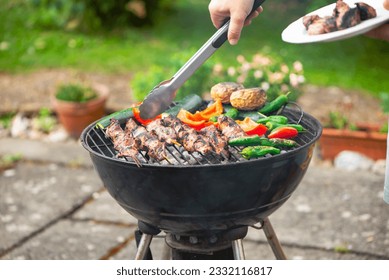 cook barbecue with vegetables in the grill in the garden in summer
 - Shutterstock ID 2332116817