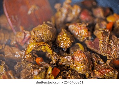 cook beef and veal slices with onions and carrots. Festive dinner - Powered by Shutterstock