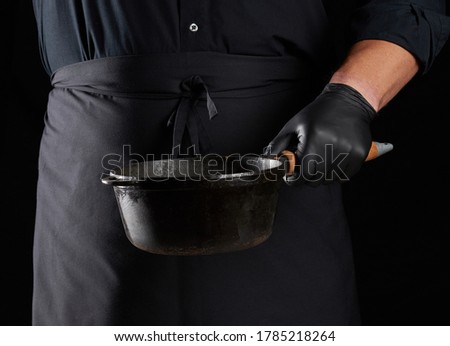 Similar – Image, Stock Photo empty black round frying pan with handle and spoon