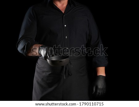 Similar – Image, Stock Photo empty black round frying pan with handle and spoon