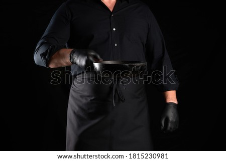 Similar – Image, Stock Photo empty black round frying pan with handle and spoon