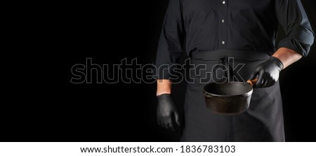 Similar – Image, Stock Photo empty black round frying pan with handle and spoon