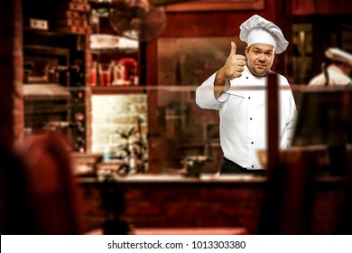 Cook chef and his own small business. Restaurant interior background.  - Powered by Shutterstock