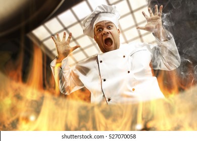 Cook Chef In Kitchen And Fire In Pot 