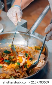 A Cook Cooking Chicken And Broccoli Stir Fry In Restaurant. Asian Cuisine. Stir Frying A Chinese Cooking Technique.