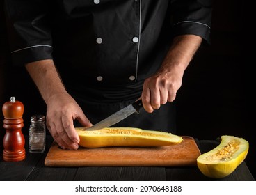 Cook Cuts Ripe Yellow Marrow With A Knife. Fried Zucchini Is A Great Diet For Breakfast Or Lunch. Work Environment On The Kitchen Table Of The Restaurant