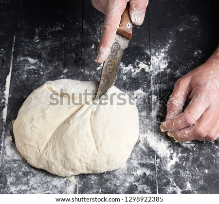 Similar – woman kneading bread dough with her hands