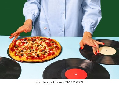 Cook or dj. Food pop art photography. Female hands with italian pizza lying on vinyl discs on light tablecloth isolated on green background. Vintage, retro style interior. Complementary colors,