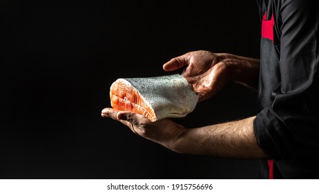 Cook hands prepares steak fish salmon, The big piece salmon is in the hands of the chef cook. banner, menu recipe place for text. - Powered by Shutterstock