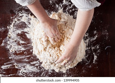 Cook Hands Preparing Pizza Dough On A Wooden Table Overhead Shot