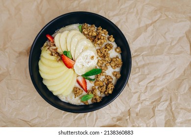 The Cook Has Just Made A New Dish Wit Fruits For The Visitors. It Looks Tasty And Delicious. There Are A Few Strawberries, Bananas And Nuts.