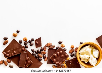 Cook homemade chocolate with bars, nuts, coffee beans on white background top view mock up