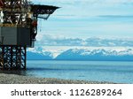 Cook Inlet and mountains with Oil platform service station