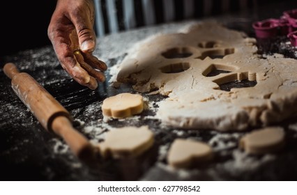 Cook makes dough pastry in baking molds - Powered by Shutterstock