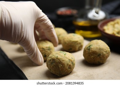 Cook Making Falafel Balls At Black Table, Closeup